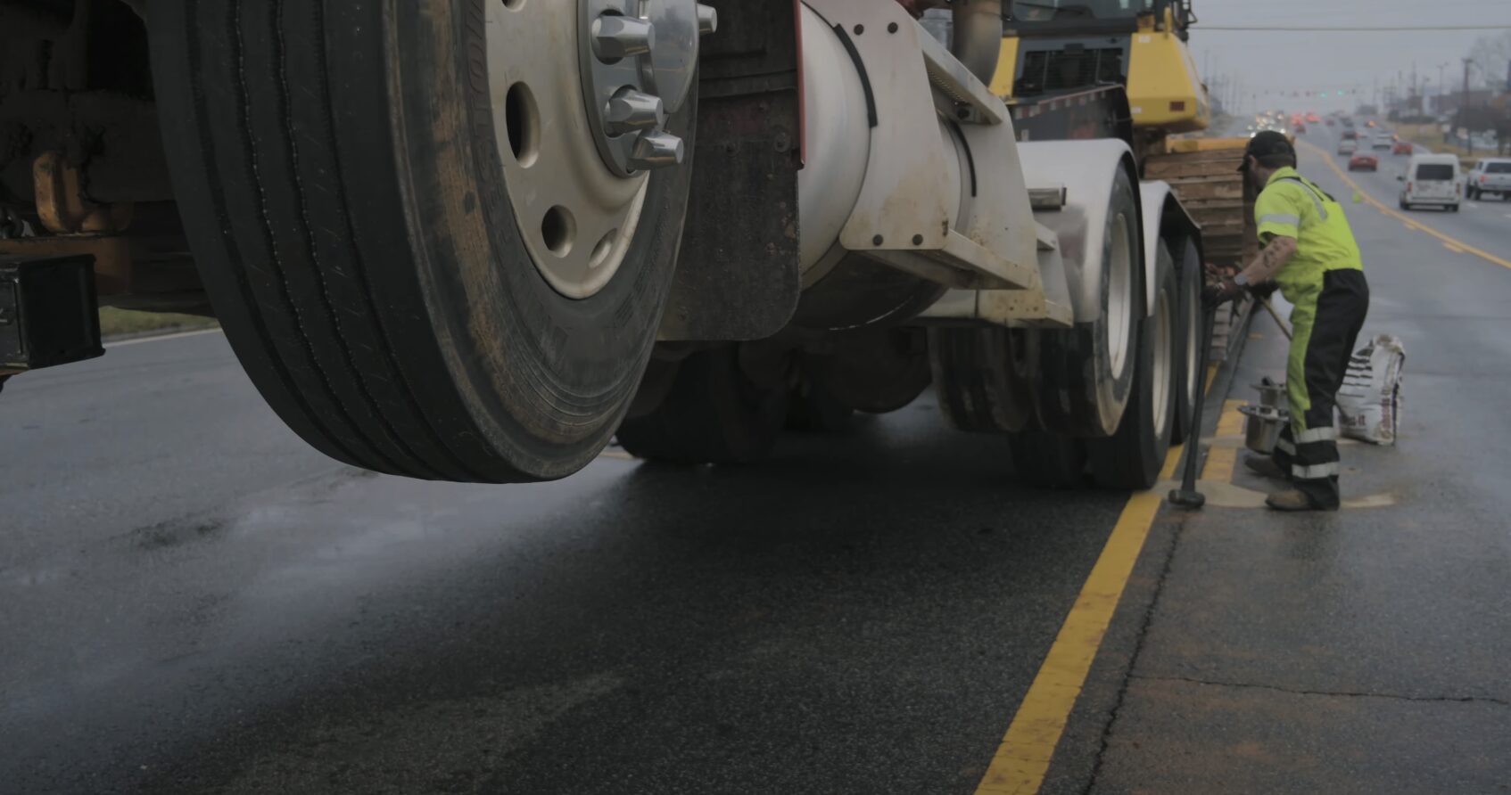 Heavy-duty tow truck on highway providing roadside assistance